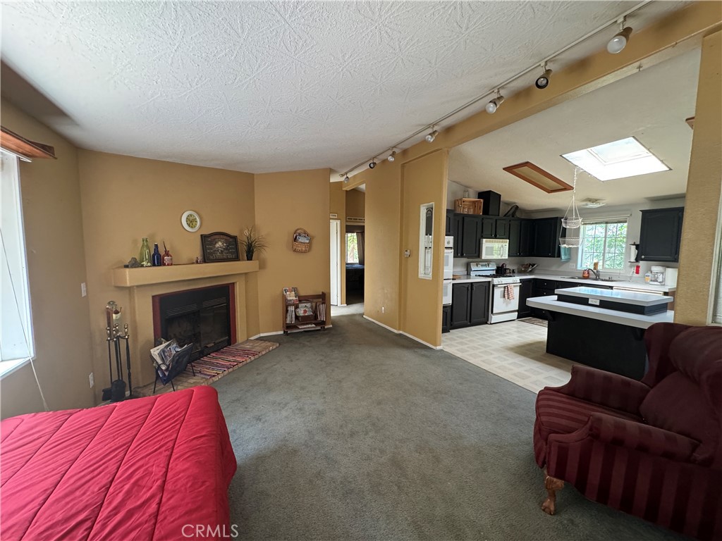 80 Rasmusen Lane Junction City, CA 96048 - Photo 13 of 67 a living room with furniture and a fireplace