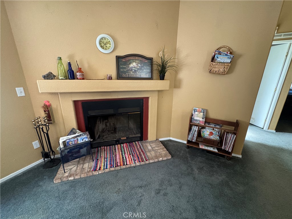 80 Rasmusen Lane Junction City, CA 96048 - Photo 16 of 67 a living room with furniture and a fireplace
