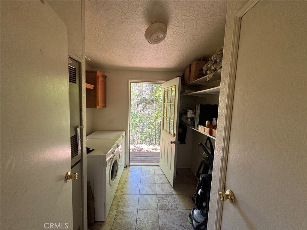80 Rasmusen Lane Junction City, CA 96048 - Photo 21 of 67 a utility room with closet dryer and washer