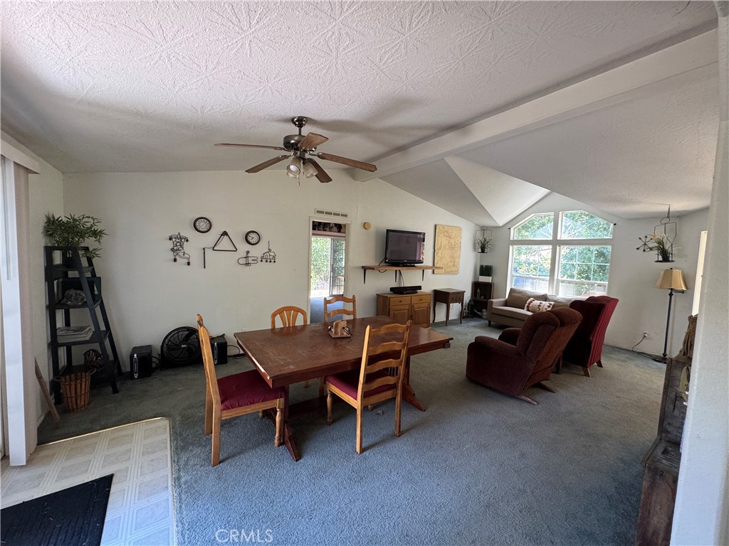 80 Rasmusen Lane Junction City, CA 96048 - Photo 25 of 67 a living room with furniture a window and a flat screen tv