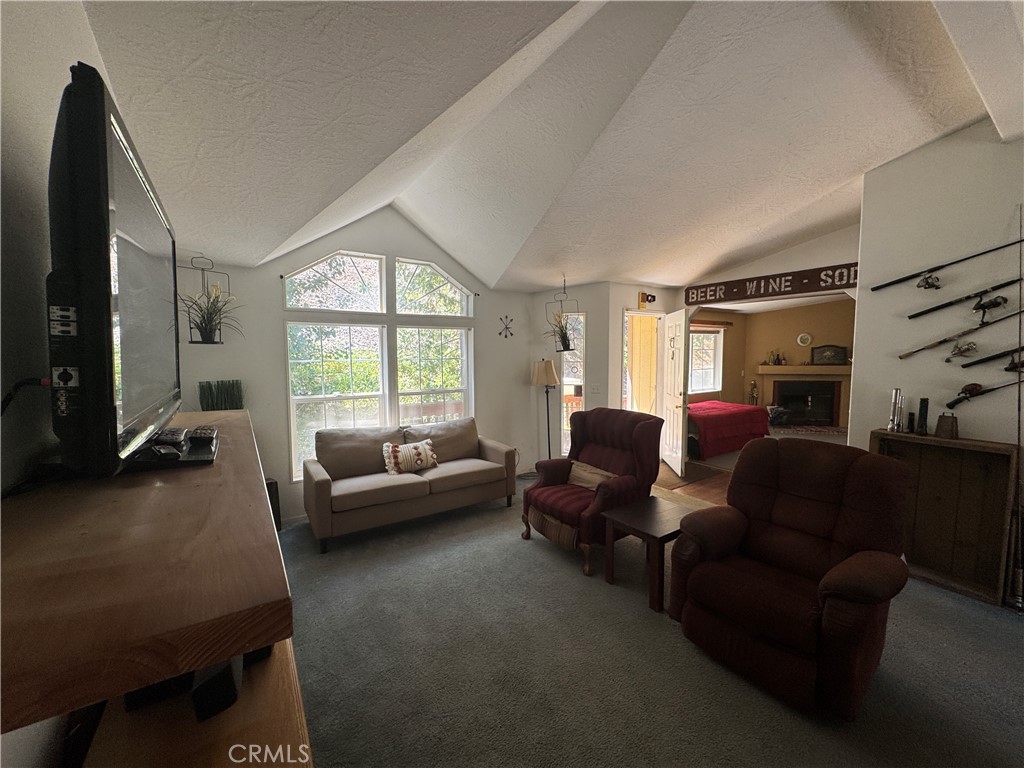 80 Rasmusen Lane Junction City, CA 96048 - Photo 30 of 67 a living room with furniture and a large window