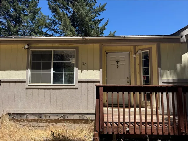 a view of a house with a snow in the yard