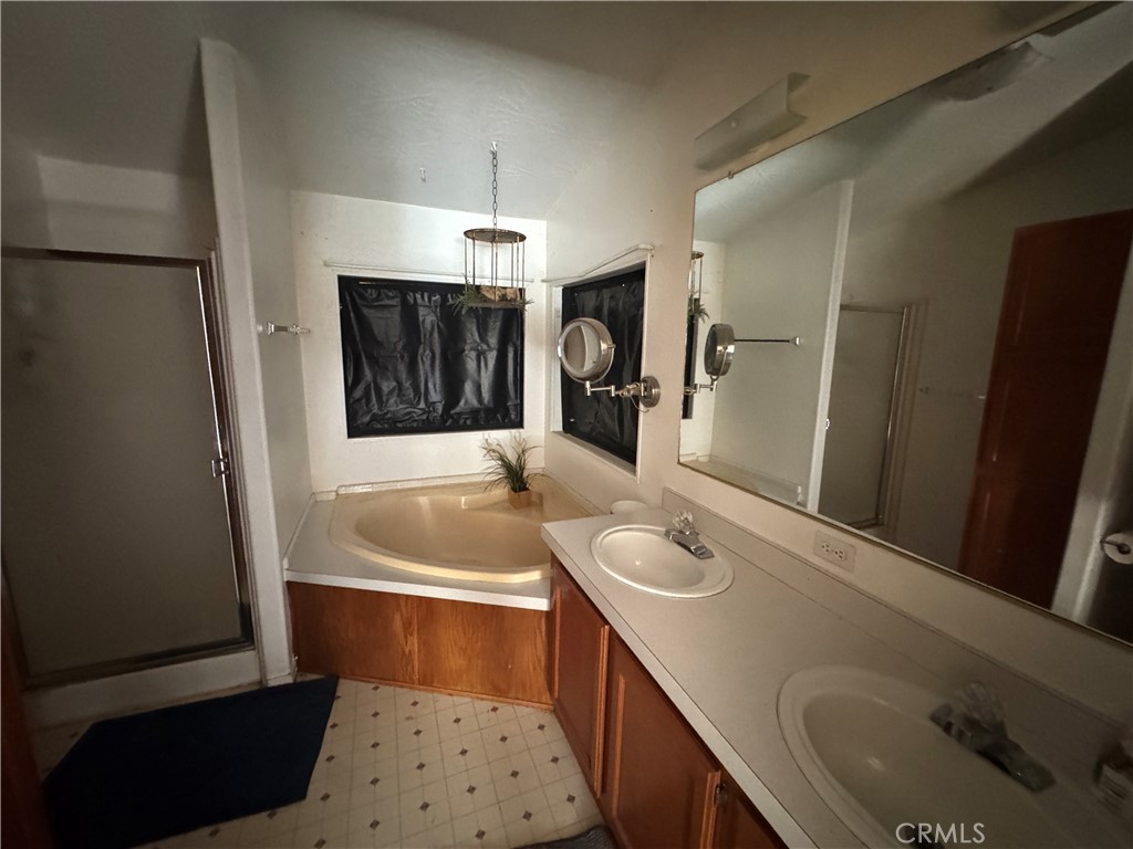 80 Rasmusen Lane Junction City, CA 96048 - Photo 35 of 67 a bathroom with a sink a bathtub a mirror and shower