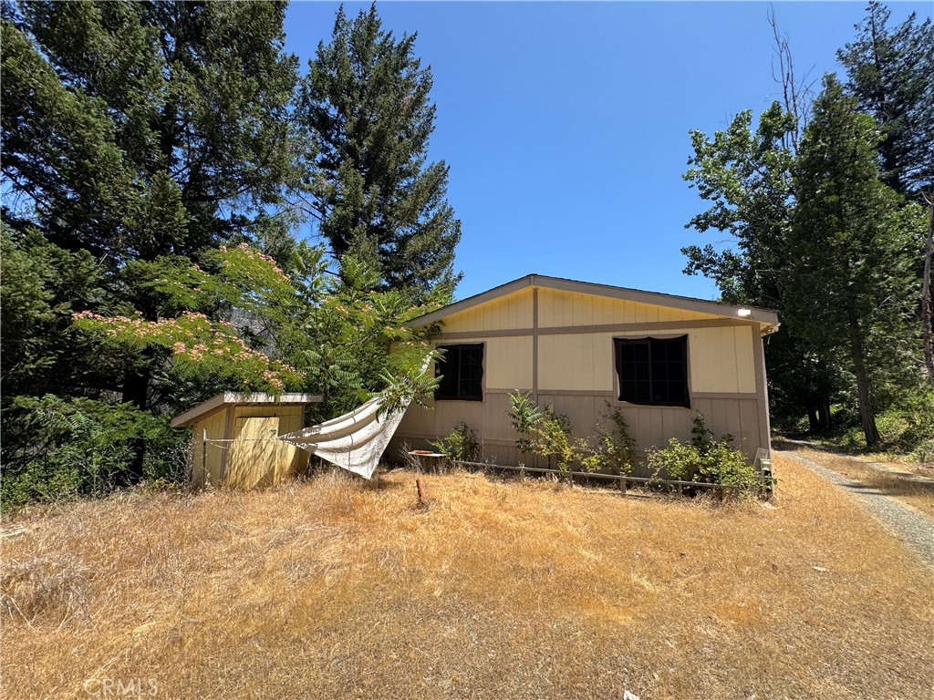 80 Rasmusen Lane Junction City, CA 96048 - Photo 37 of 67 a front view of a house with a yard