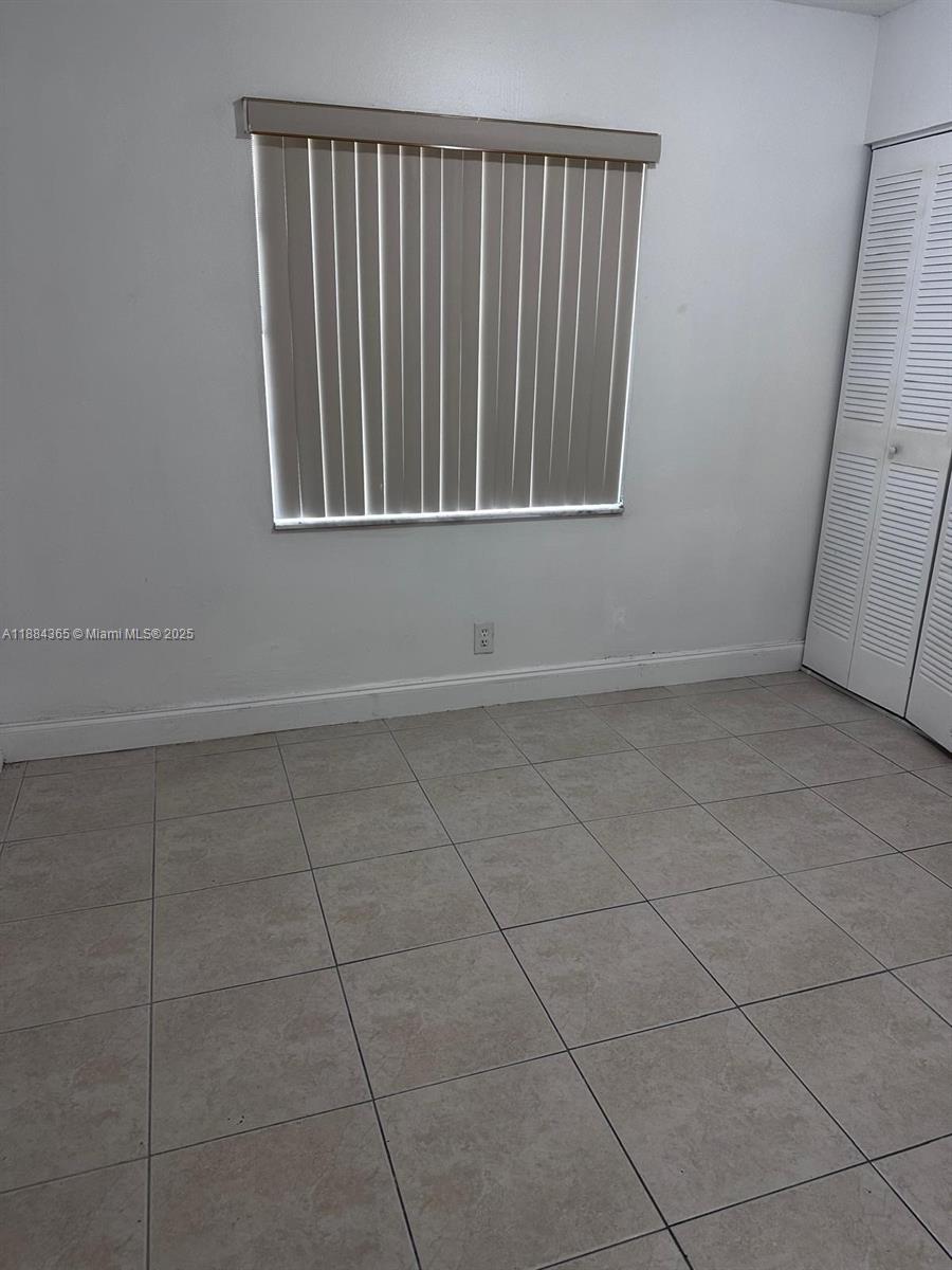 10124 Twin Lakes Drive, Unit 11D Coral Springs, FL 33071 - Photo 8 of 12 a view of wooden floor in a room