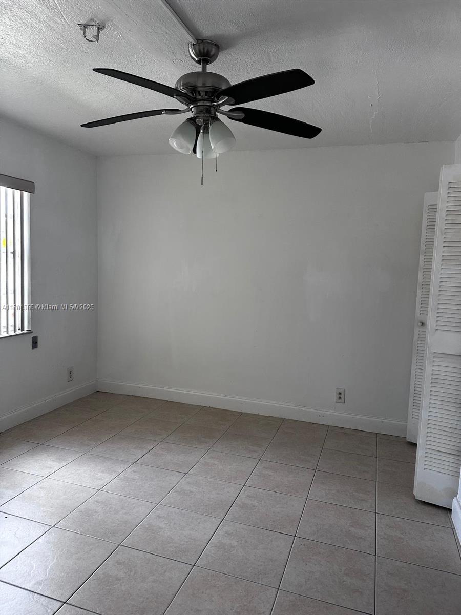 10124 Twin Lakes Drive, Unit 11D Coral Springs, FL 33071 - Photo 9 of 12 a view of an empty room with a window