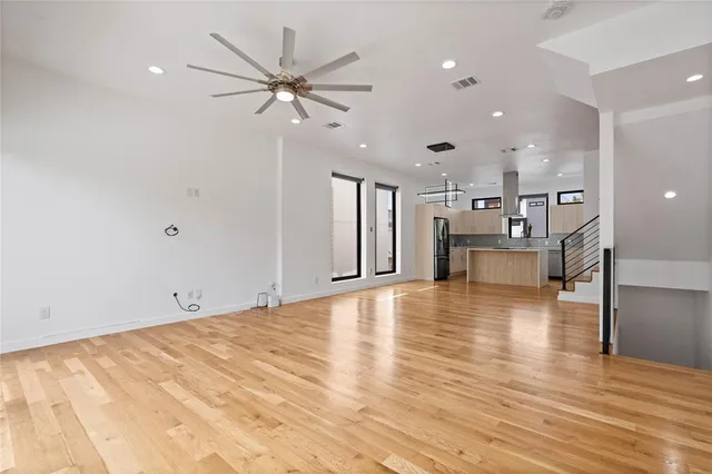 a view of kitchen with cabinets and wooden floor
