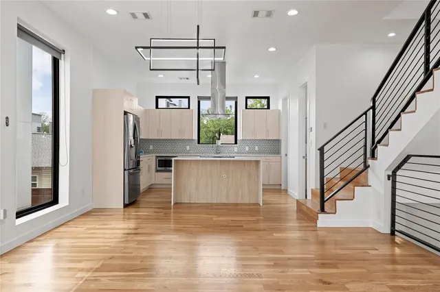 a view of kitchen with cabinets and wooden floor