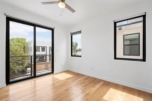 an empty room with windows and closet
