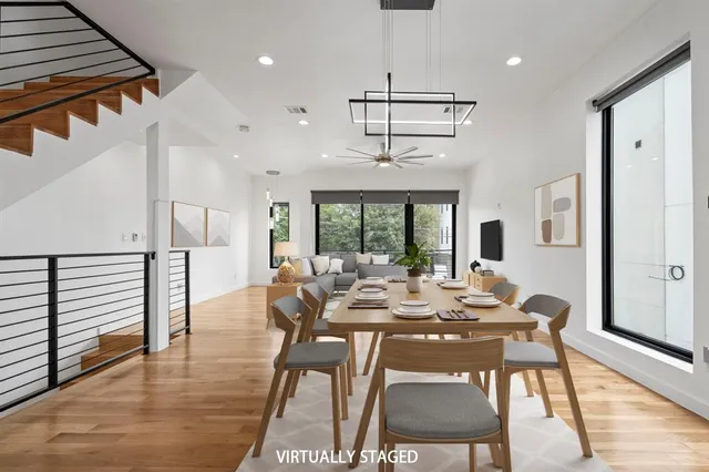 a view of a dining room with furniture window and wooden floor