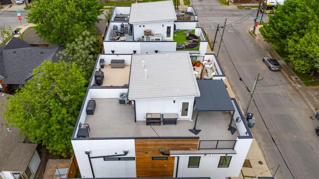 an aerial view of a house with outdoor space