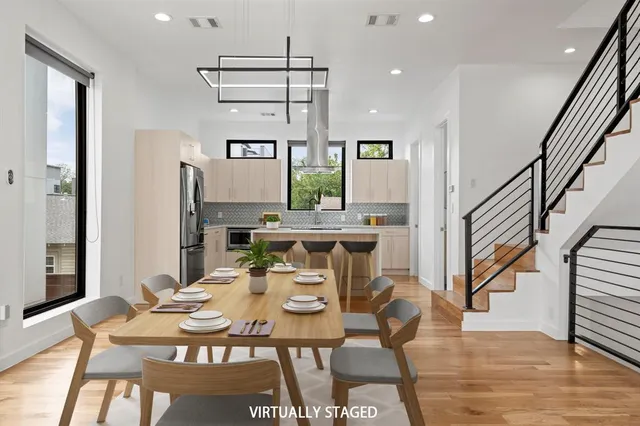 a view of a dining room with furniture window and wooden floor