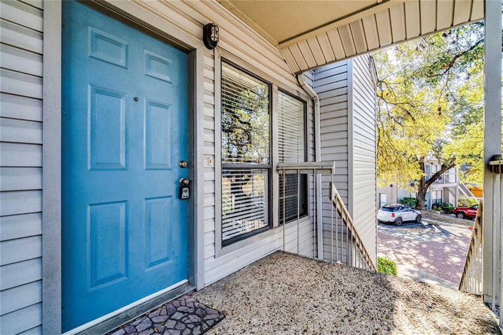 802 South 1st Street, Unit 206 Austin, TX 78704 - Photo 16 of 18 a view of a porch with a door and wooden floor