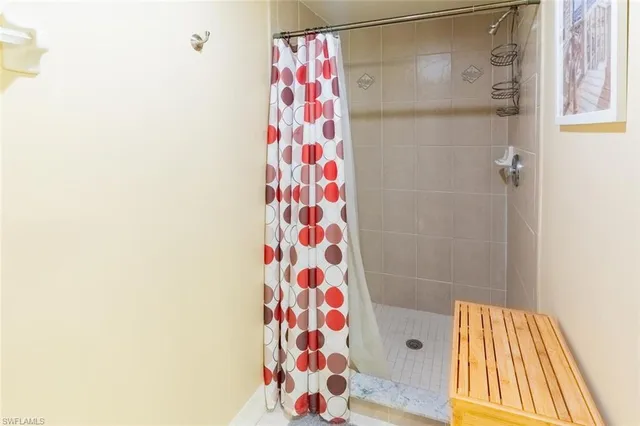a bathroom with a bathtub and shower