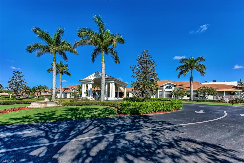 1100 Eastham Way, Unit A105 Naples, FL 34104 - Photo 24 of 27 a view of a house with a yard