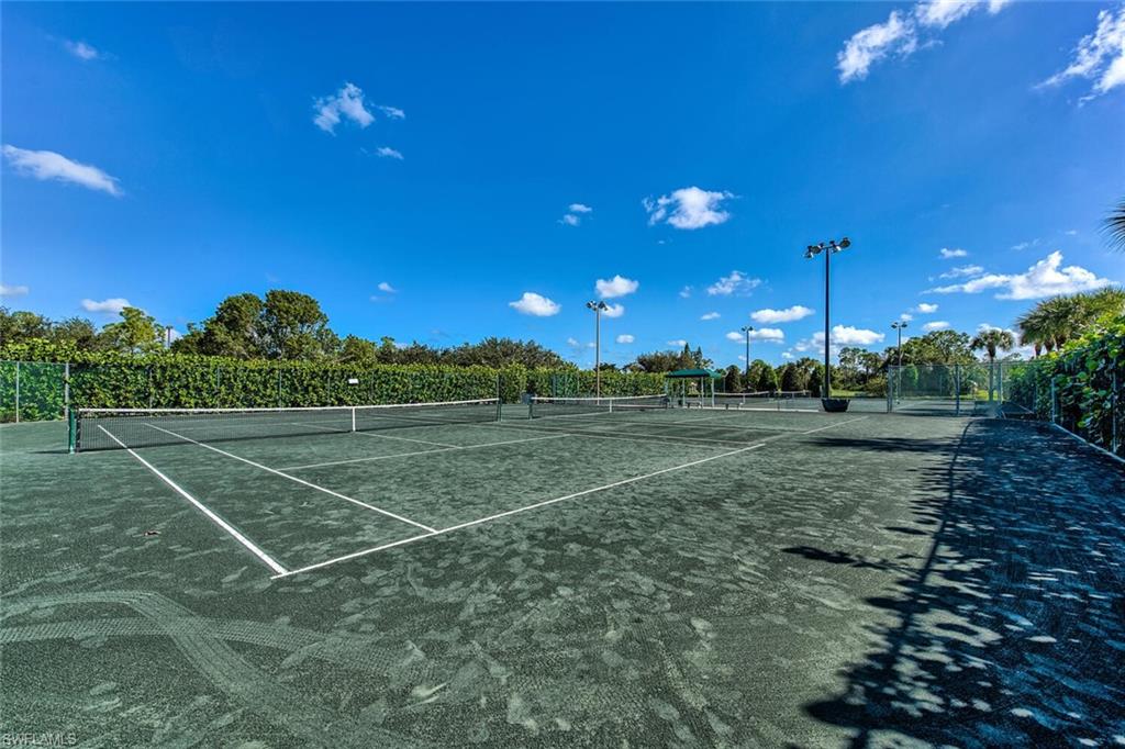 1100 Eastham Way, Unit A105 Naples, FL 34104 - Photo 27 of 27 a view of a tennis court