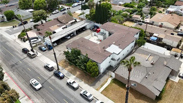 an aerial view of a house with outdoor space