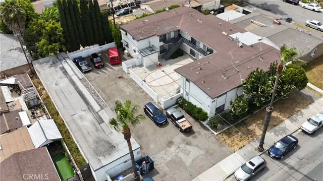 an aerial view of a house with outdoor space