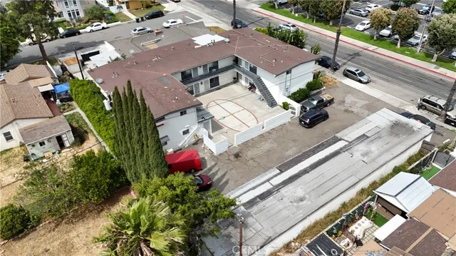 an aerial view of a house with a garden and balcony