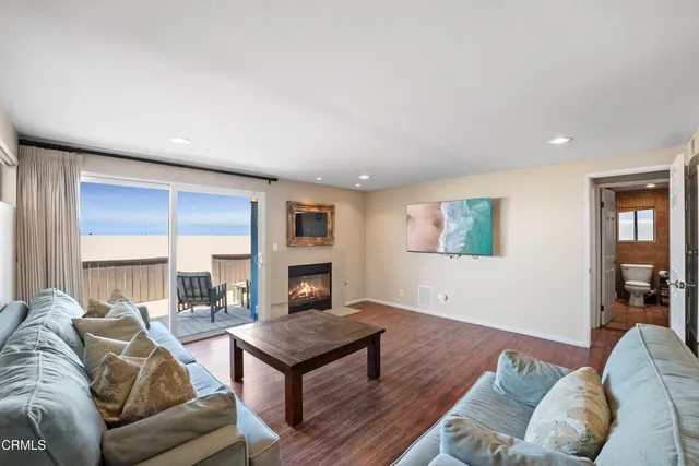 a bathroom with a double vanity sink toilet and a tub