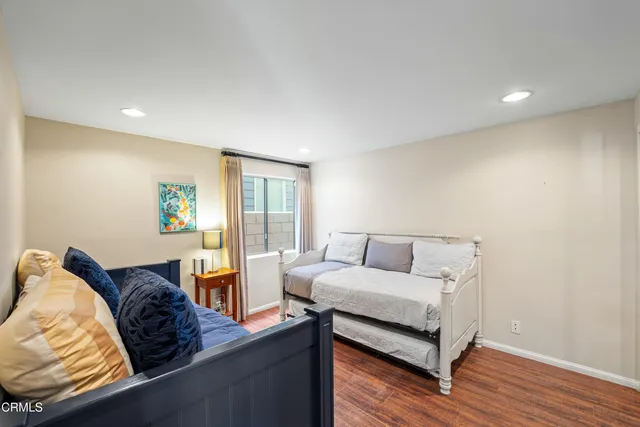 a bathroom with a toilet a sink and a mirror