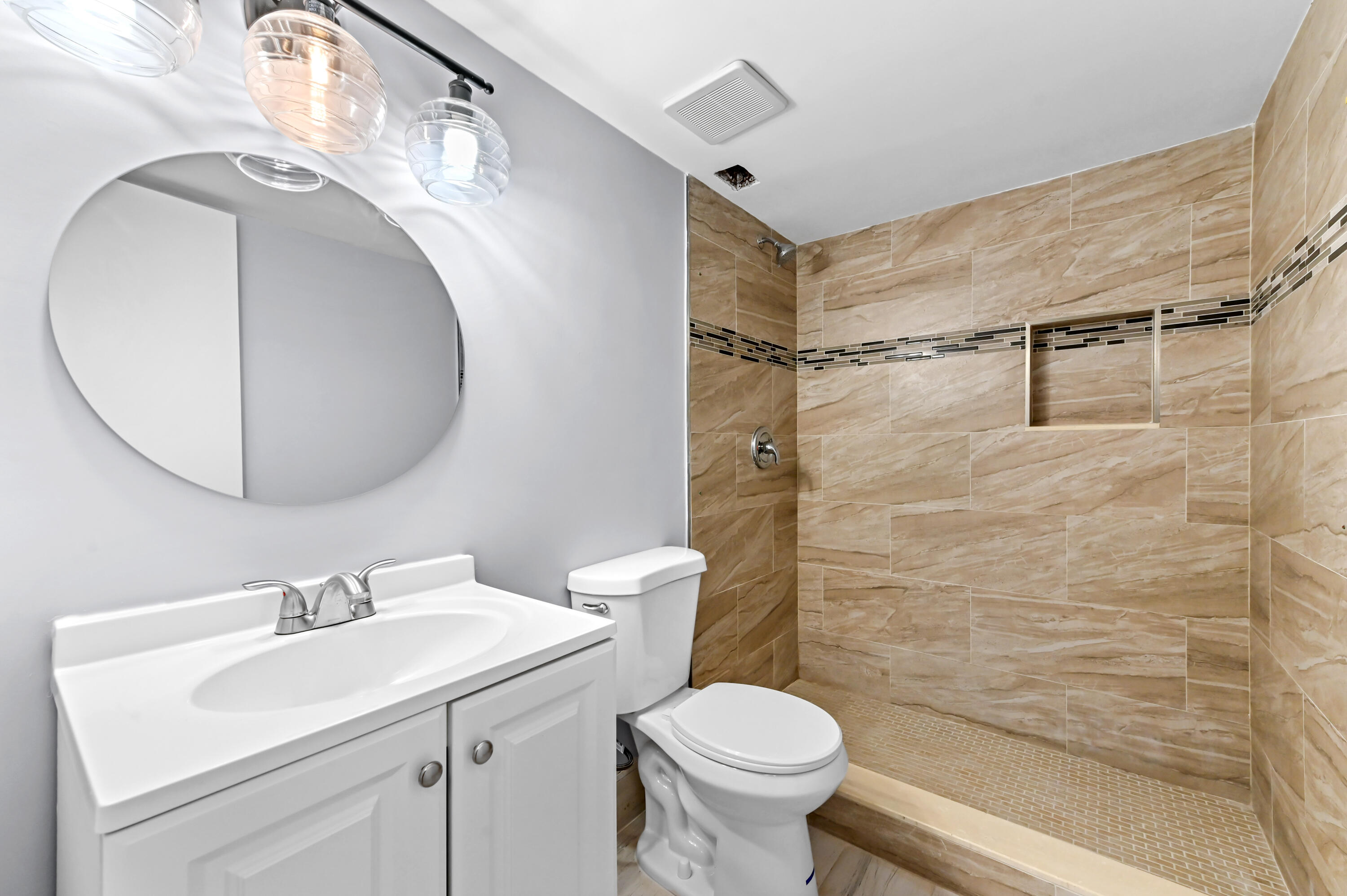 5500 Northwest 2nd Avenue, Unit 617 Boca Raton, FL 33487 - Photo 17 of 39 a bathroom with a sink toilet and shower