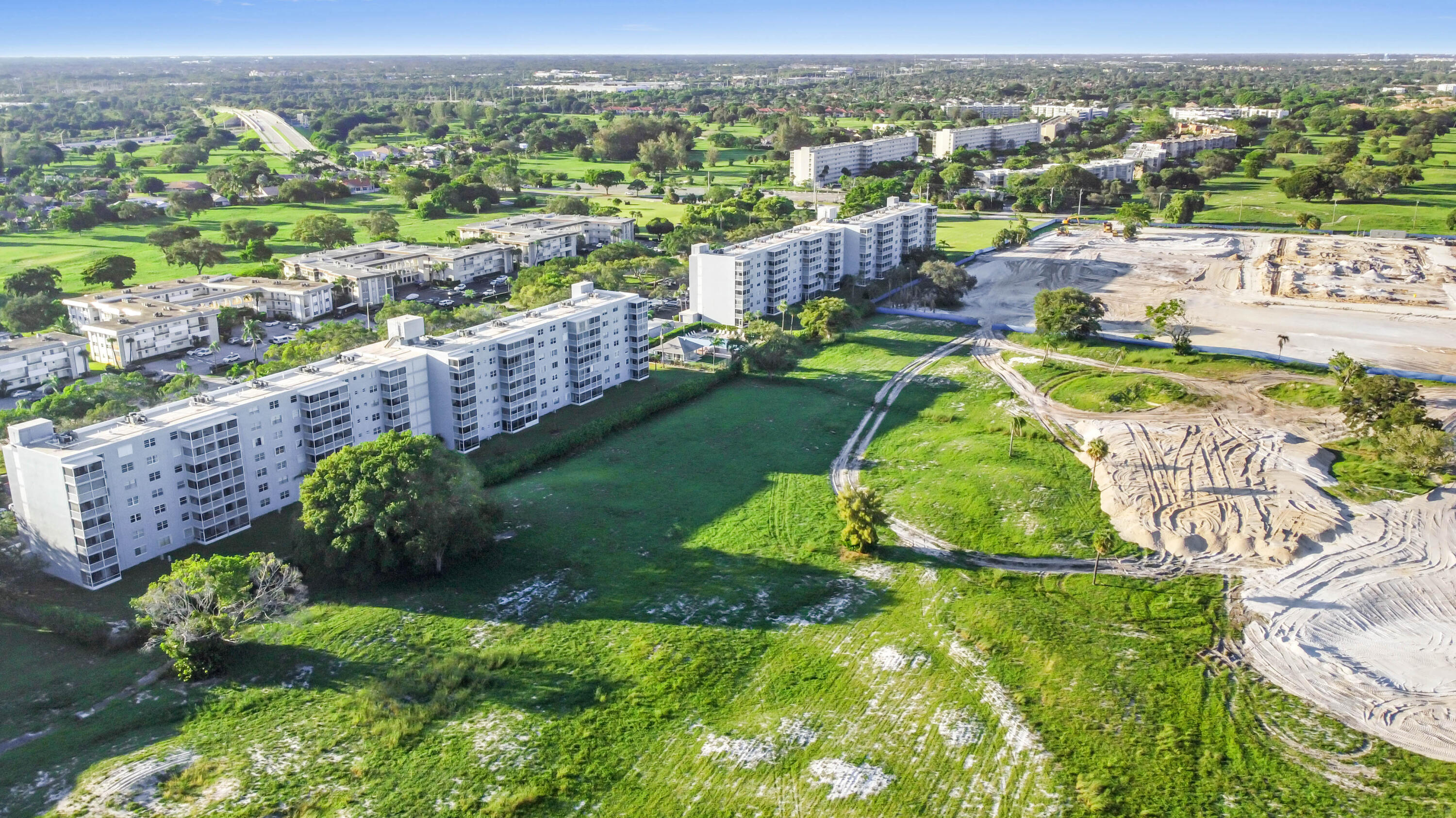5500 Northwest 2nd Avenue, Unit 617 Boca Raton, FL 33487 - Photo 36 of 39 an aerial view of a house with a garden and lake view
