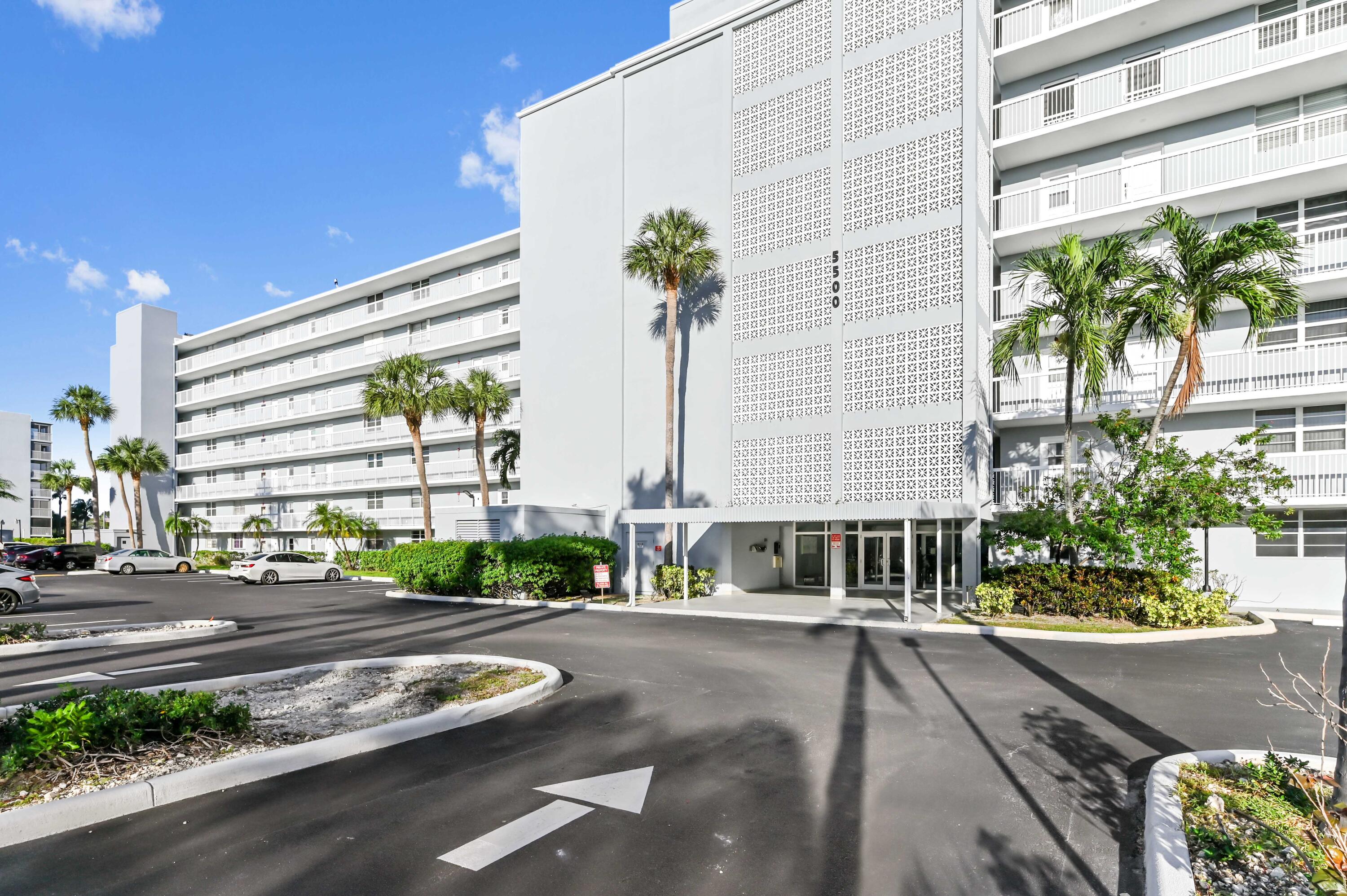 5500 Northwest 2nd Avenue, Unit 617 Boca Raton, FL 33487 - Photo 5 of 39 a building with trees in front of it