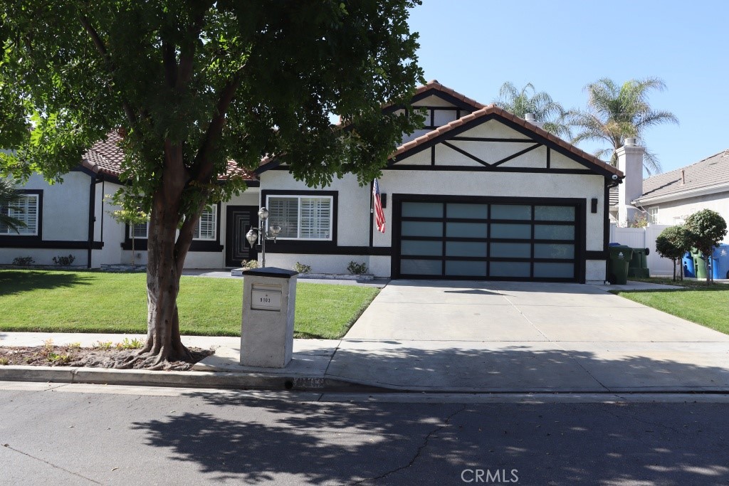 9103 Wystone Avenue Northridge, CA 91324 - Photo 12 of 59 a front view of a house with a yard and garage