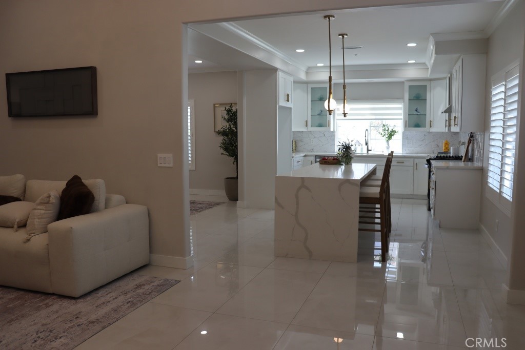 9103 Wystone Avenue Northridge, CA 91324 - Photo 16 of 59 a living room with furniture and a flat screen tv