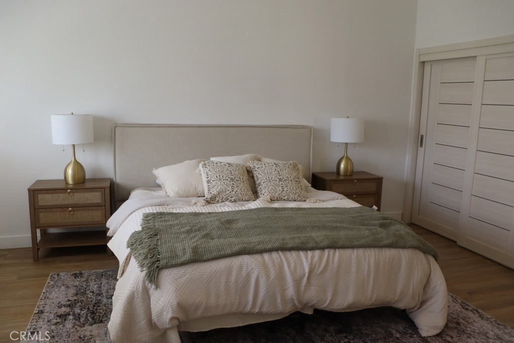 9103 Wystone Avenue Northridge, CA 91324 - Photo 27 of 59 a bedroom with a bed and a night stand