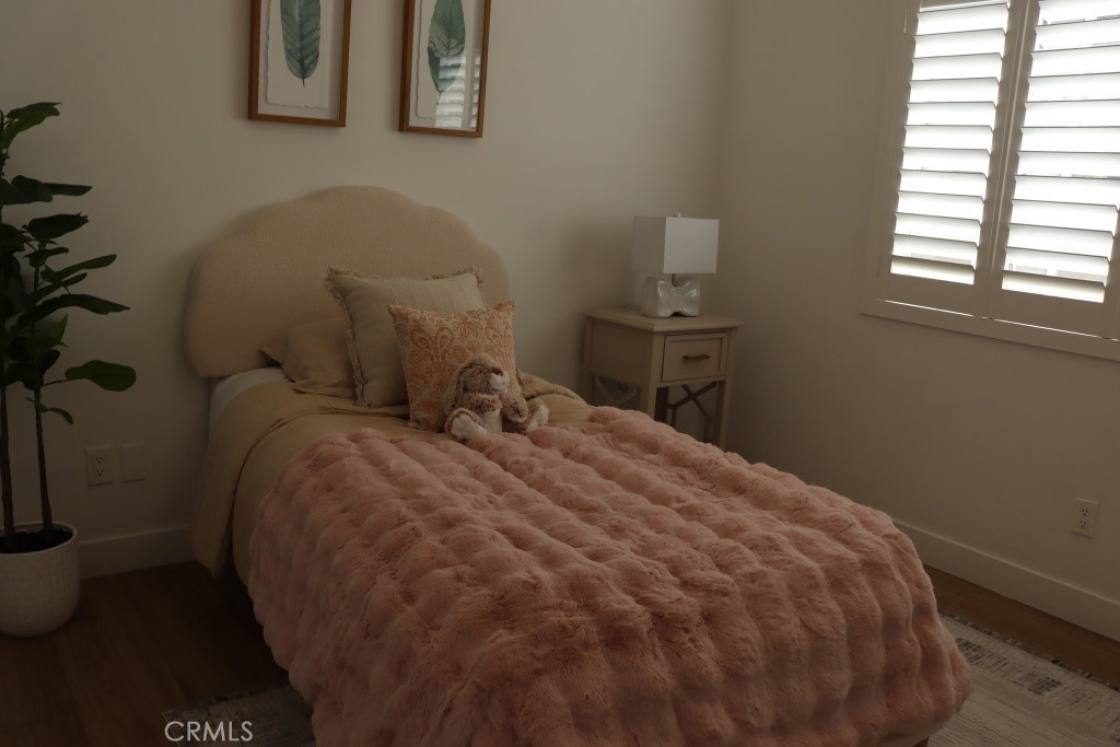 9103 Wystone Avenue Northridge, CA 91324 - Photo 30 of 59 a bed sitting in a bedroom next to a window