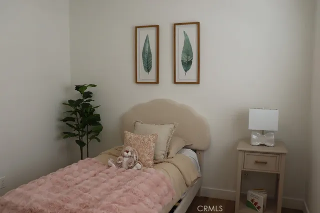 a bathroom with a granite countertop sink toilet a mirror and shower