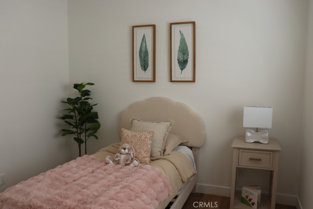 9103 Wystone Avenue Northridge, CA 91324 - Photo 31 of 59 a bedroom with a bed and a table in it