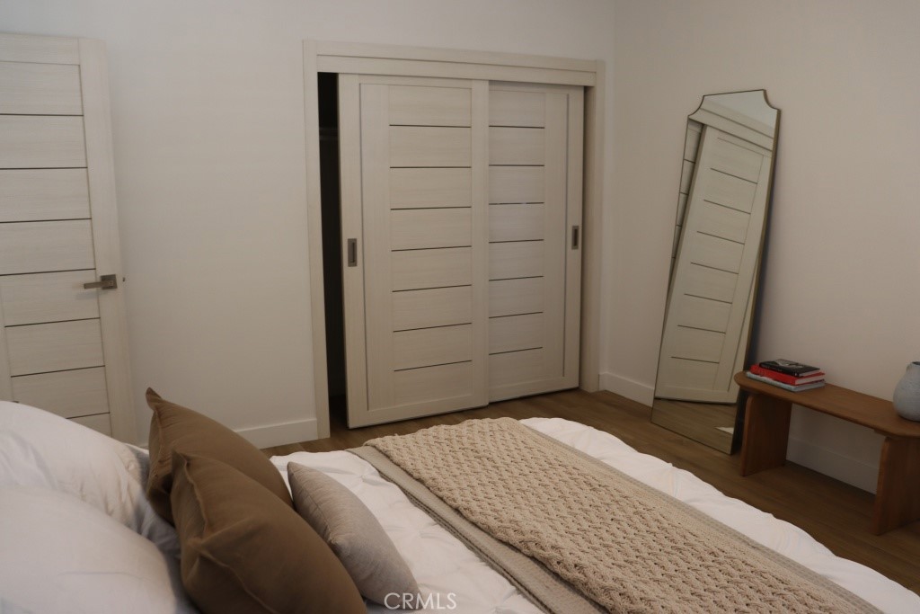 9103 Wystone Avenue Northridge, CA 91324 - Photo 34 of 59 a bedroom with a bed and cabinets