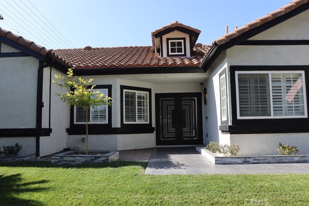 9103 Wystone Avenue Northridge, CA 91324 - Photo 4 of 59 a front view of a house with garden