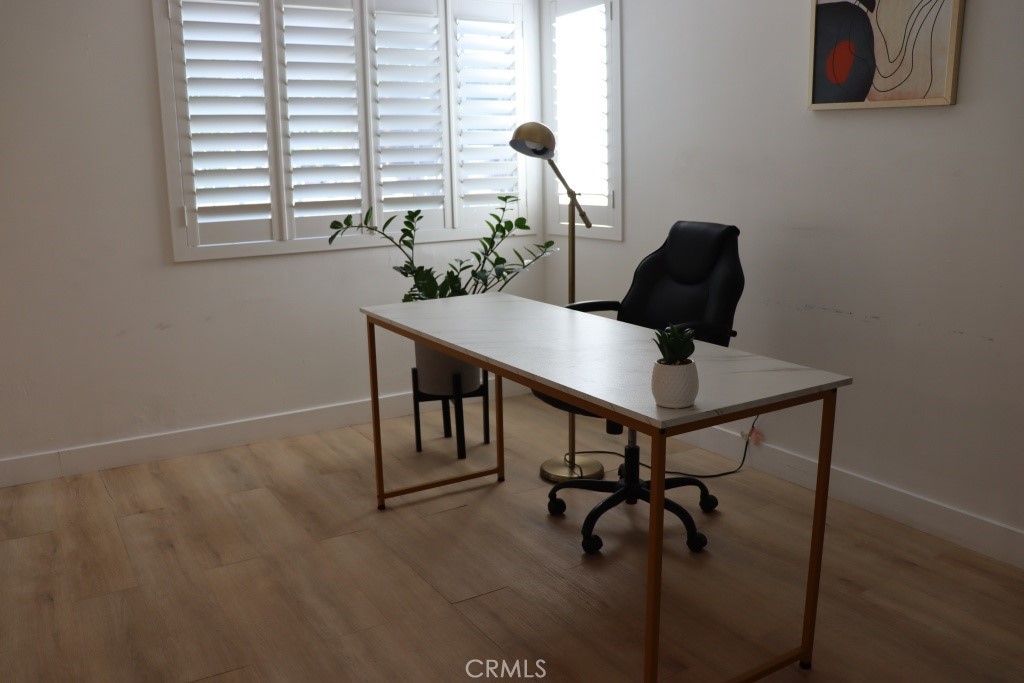9103 Wystone Avenue Northridge, CA 91324 - Photo 43 of 59 a view of a workspace with furniture and a window