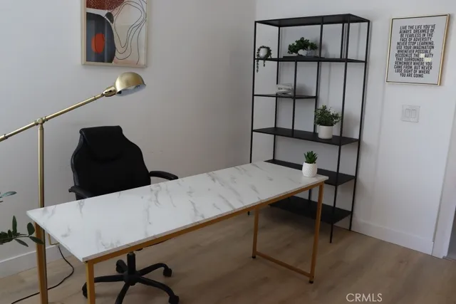 a view of a garden with plants and a fountain