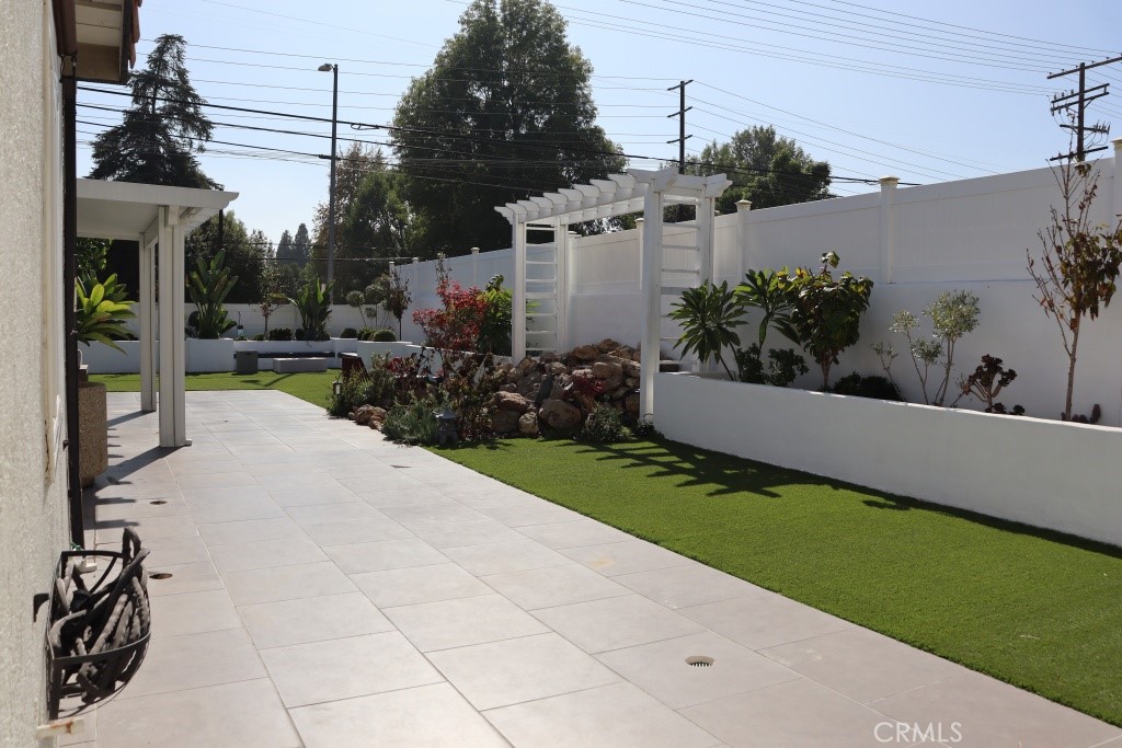 9103 Wystone Avenue Northridge, CA 91324 - Photo 46 of 59 a view of a terrace with chairs and potted plants