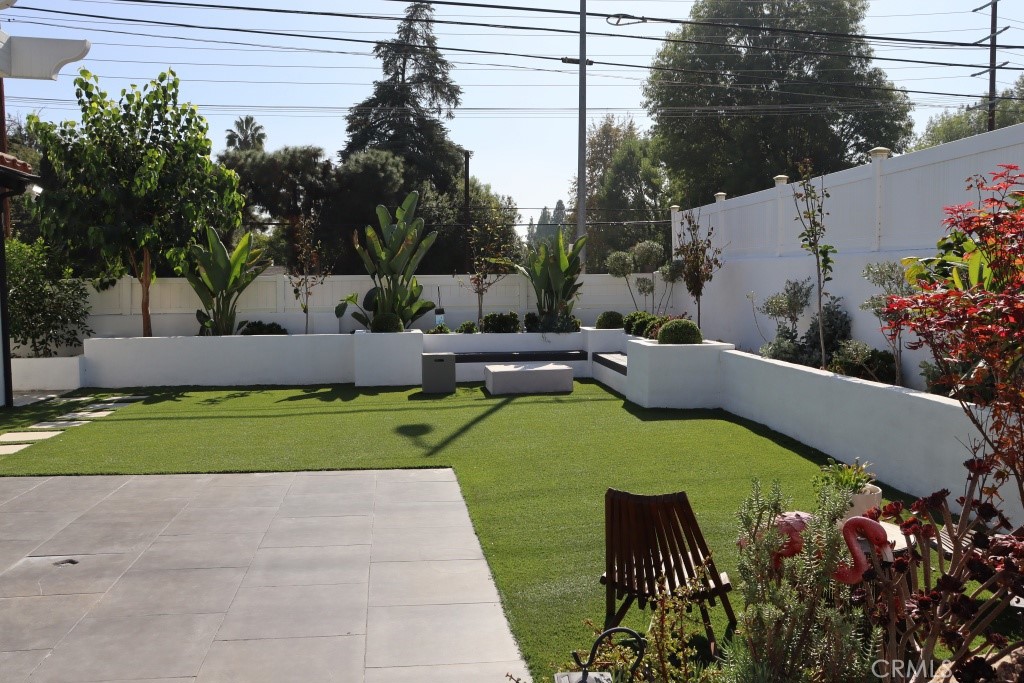 9103 Wystone Avenue Northridge, CA 91324 - Photo 51 of 59 a view of a garden with plants and a fountain