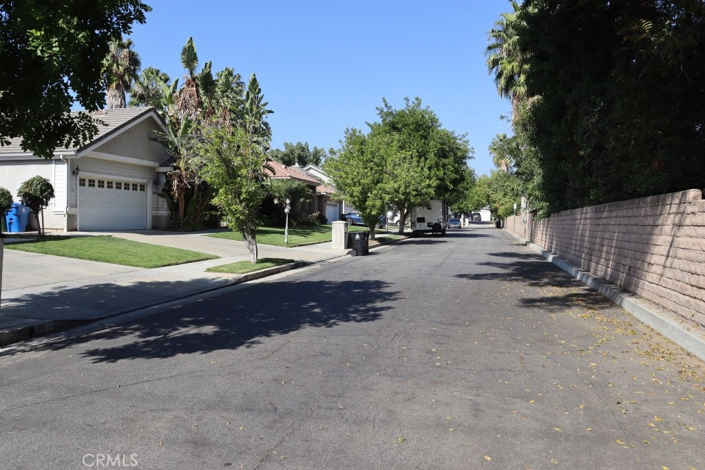 9103 Wystone Avenue Northridge, CA 91324 - Photo 9 of 59 a row of palm trees in front of house