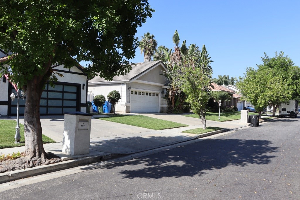 9103 Wystone Avenue Northridge, CA 91324 - Photo 10 of 59 a view of a house with a yard and large tree