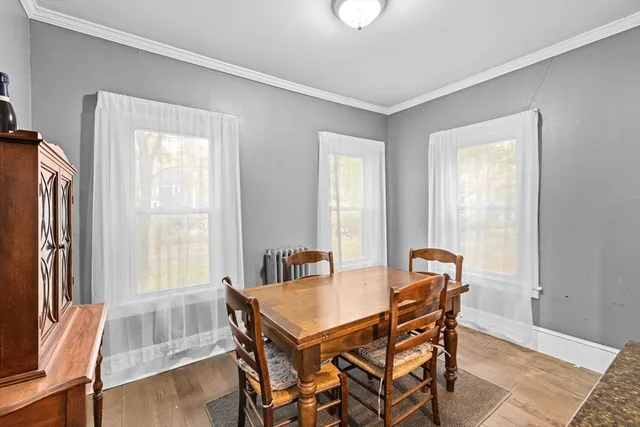 a dining room with furniture and window