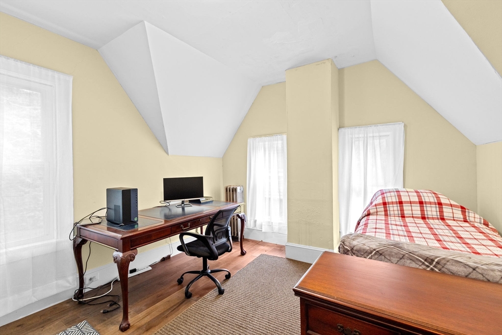 168 Spring Street Hanson, MA 02341 - Photo 25 of 40 a bedroom with a bed and a desk