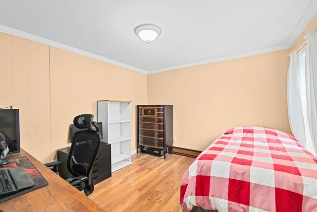 a bedroom with a bed and dresser