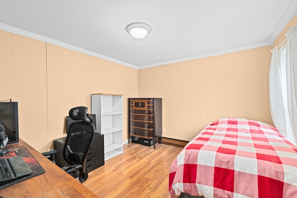 168 Spring Street Hanson, MA 02341 - Photo 28 of 40 a bedroom with a bed and dresser