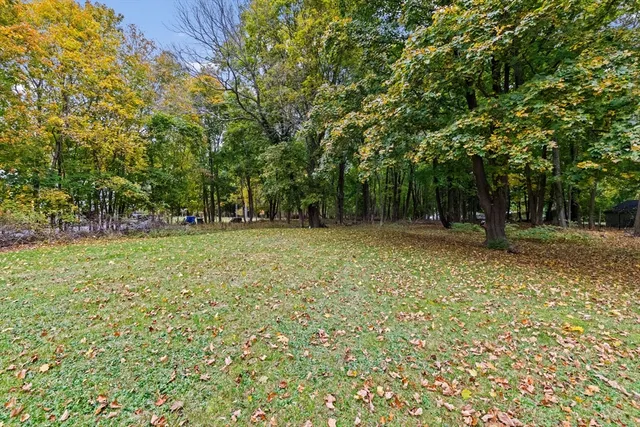 a view of outdoor space with deck and yard