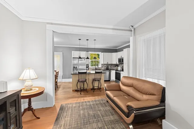 a living room with furniture and a table