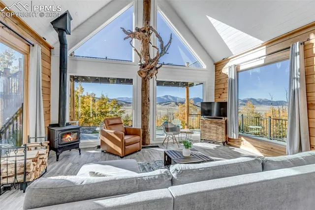 a spacious bedroom with a large bed and a couch