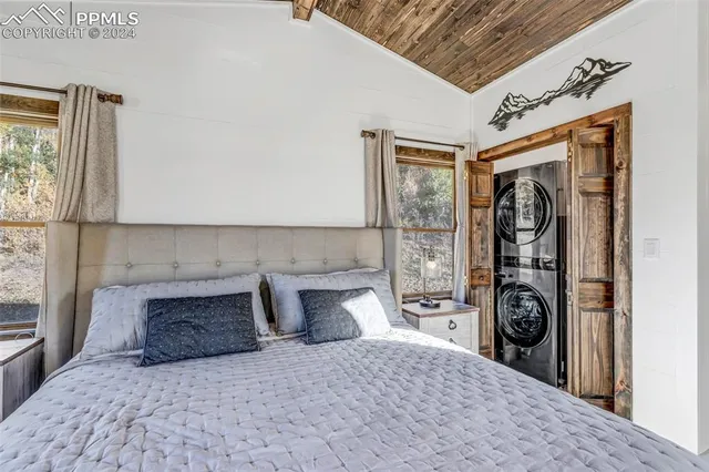 a view of a chair and table in backyard of the house